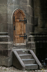 Fototapeta na wymiar Antique castle wood door with iron elements