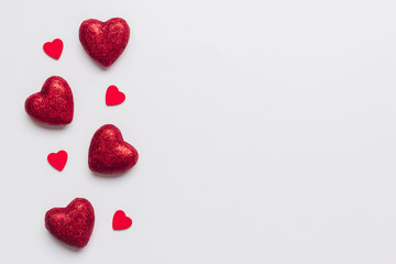 Stock photo of red hearts on a white background with a space for text