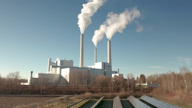 AS Heating Power Plant Munich North with solar cells in front of it