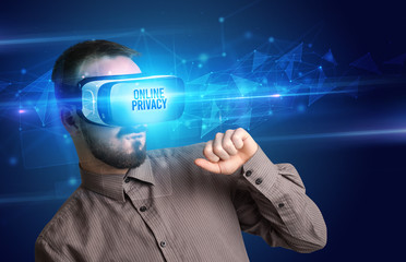 Businessman looking through Virtual Reality glasses with ONLINE PRIVACY inscription, cyber security concept