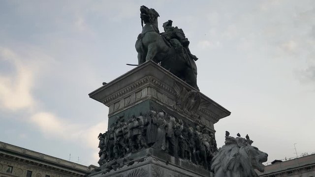 Tilt up real time medium shot of the equestrian statue of Victor Emmanuel II. Center Of Milan, Italy.