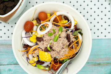 Bowl of mixed vegetables in tuna salad. 