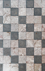 Wide geometric checkered floor with marble tiles