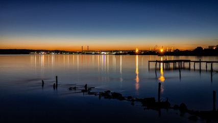 Industrial night view at the coast of lake