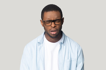African guy crying whining feels lonely or offended studio shot