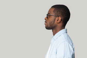 African man isolated on gray background side profile view face