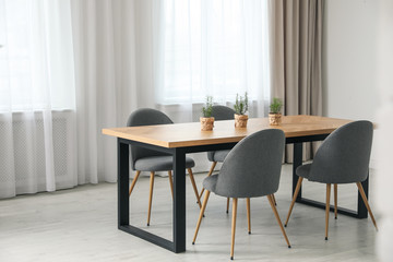 Modern room interior with chairs and table