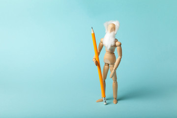 The figure of an adult wise grandfather with a pencil. Training for seniors.