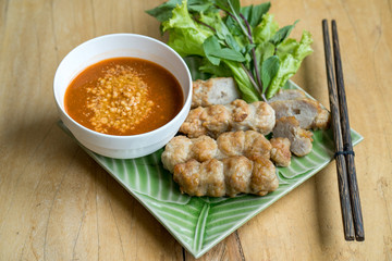 Vietnamese Meatball Wraps on wooden table.