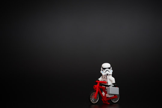 Orvieto, Italy - November 22th 2015: Group of Star Wars Lego Stormtroopers minifigures go to work on bicycle. Lego is a popular line of construction toys manufactured by the Lego Group
