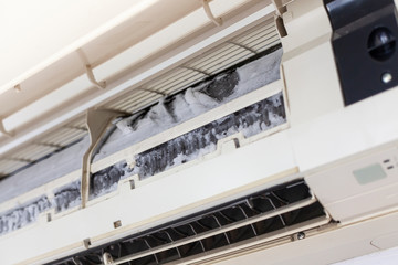 Cleaning the ice on the air filter of the air conditioner.air conditioner drain problem