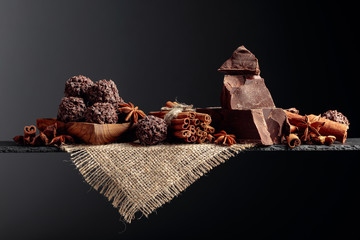 Chocolate truffles with broken pieces of chocolate and spices.