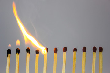 burning match on black background