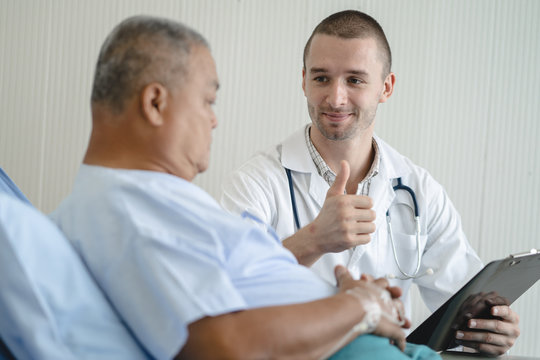 Doctor Checking Patient After Surgery And Having A Good Recovery.