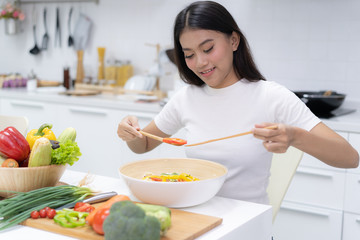 Eat healthy food for good wellness health concept. Woman cooking salad menu with fresh organic vegetables