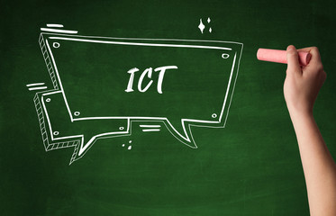 Hand drawing ICT abbreviation with white chalk on blackboard
