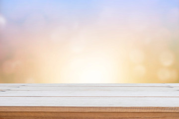Empty wood table top on blur nature background.