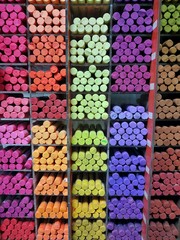 Oil pastels on the counter in the store. Stand with colored oil pastels pantone 2020