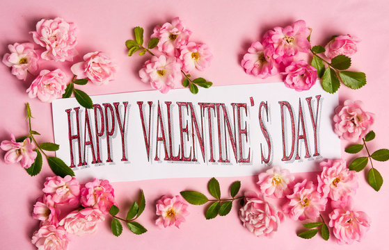 Happy Valentines day card with pink roses arrangement