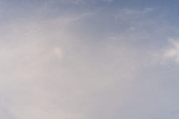 Tiny clouds against blue sky.