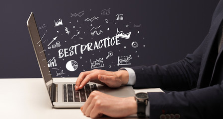 Businessman working on laptop with BEST PRACTICE inscription, modern business concept