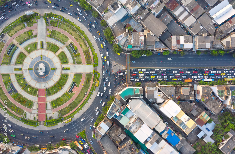Wall mural Road roundabout with car lots Wongwian Yai in Bangkok,Thailand. street large beautiful downtown at evening light.  Aerial view , Top view ,cityscape ,Rush hour traffic jam - Wall murals