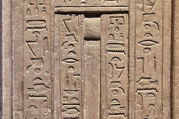 Egiptian hieroglyphs carved in sandstone