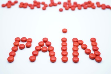 The word pain made of red pills