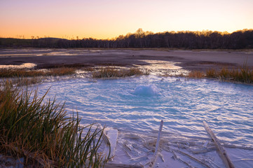 Old Crater in Manziana - carbon dioxide coming out of the earth through water and forming small...