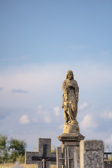 Fototapeta na wymiar Figure of Mary at the cemetery
