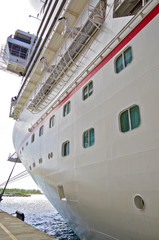 Bottom to top view of bow and starboard side of modern Carnival Cruise Lines cruise ship liner with...