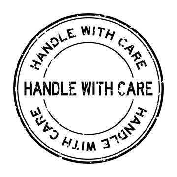Grunge black handle with care word round rubber seal stamp on white background