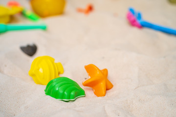Fototapeta na wymiar Beach toy set on sand at the beach.