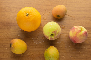 Wet orange, peaches and mangos