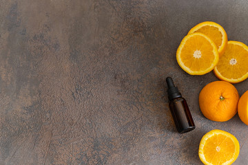 Fresh orange fruit and orange essential oil. Natural medicine and Ayurvedic treatment.  Top view