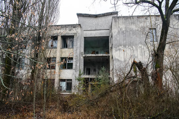Abandoned ghost town Prypiat. Overgrown trees and collapsing buildings in Chornobyl exclusion zone....