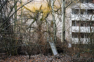 Abandoned ghost town Prypiat. Overgrown trees and collapsing buildings in Chornobyl exclusion zone....