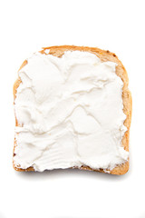 Slice of bread with sour cream spread on top