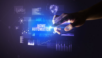 Hand touching HOME AUTOMATION inscription, new business technology concept