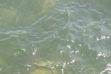 sea ​​water lit by the rays of the sun