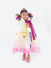 Asian little boy and girl wearing a Korean Traditional Hanbok dress in Rattan bag on white background