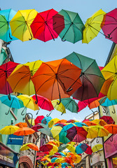 Umbrellas hanging over the street