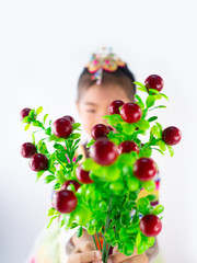 Asian little boy and girl wearing a Korean Traditional Hanbok dress in Rattan bag on white background