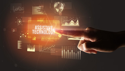 Naklejka premium Hand touching ASSISTIVE TECHNOLOGY inscription, new business technology concept