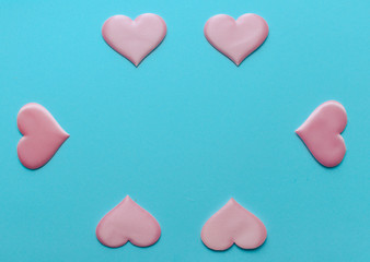 Fototapeta premium Valentine's Day background. A pink heart on blue background, flat lay minimal concept, trendy pop art style photo. Valentines day concept. Flat lay, top view, copy space