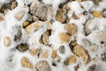light stones in white snow