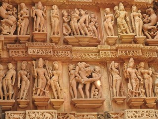 Erotic sculptures and sex poses of man in kajuraho temples, Madhya Pradesh, India. Built around 1050, it is a UNESCO world heritage site, a tourist destination. The concept of textures and postcards.