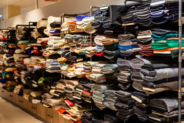 Rolls of fabric in stock. Interior of a industrial warehouse with fabric rolls.