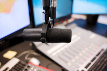 Fototapeta na wymiar Microphone in modern radio station broadcasting studio