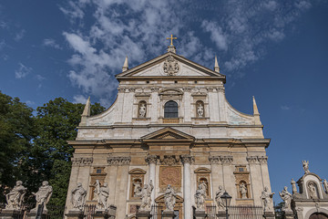 Fototapeta na wymiar Architectural fragments of Polish Baroque church of Saints Peter and Paul facade (1619) in Krakow Old Town. Krakow, Poland.